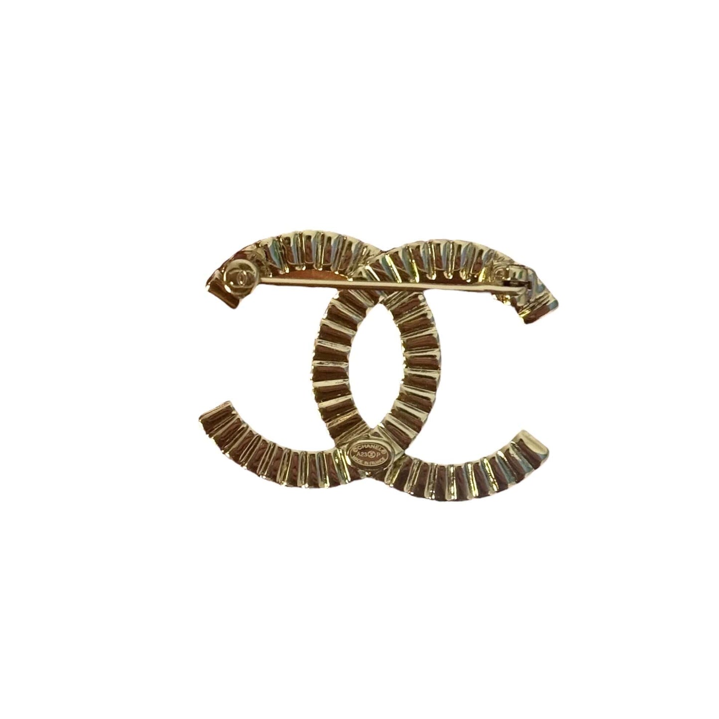 Stunning CHANEL Lighter Gold CC Brooch with clear crystals, perfect for year-round wear day or night.