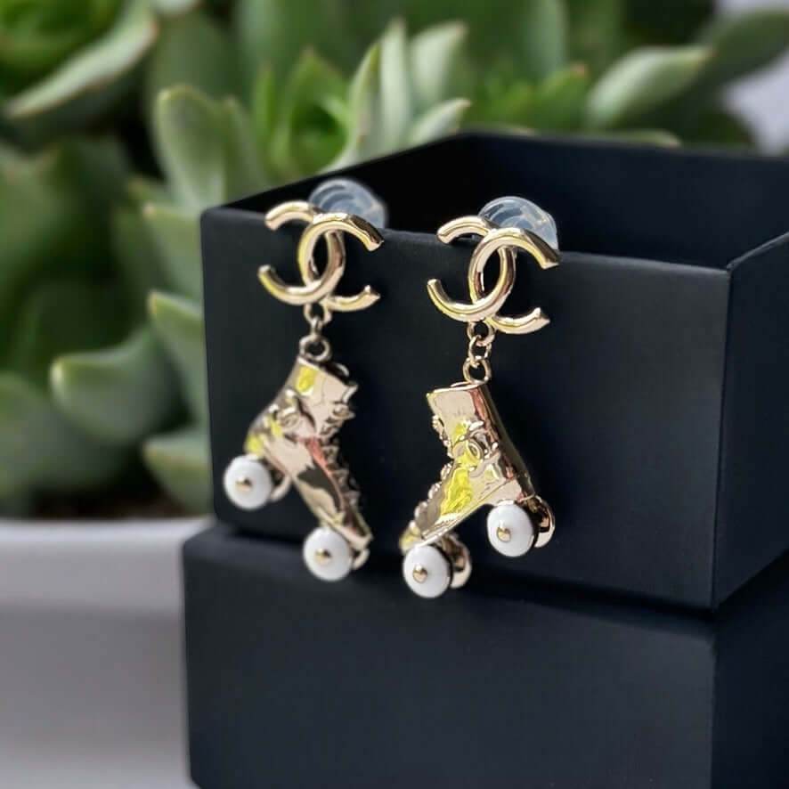 Chanel Gold CC Rollar Skates Dangling Earrings Pre-Owned - My Mama Found What