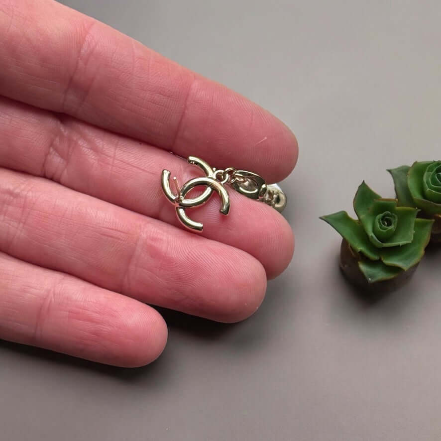 Chanel 14K Gold Tone Double C RARE Funky Rollar Skates Dangling EarringsRARE Hard To Find Unleash your fierce inner rockstar with these rare Chanel 14K Gold Tone Double C Dangling Earrings! Plated in 14k gold, the funky rollar skates with white enamel whe My Mama Found What