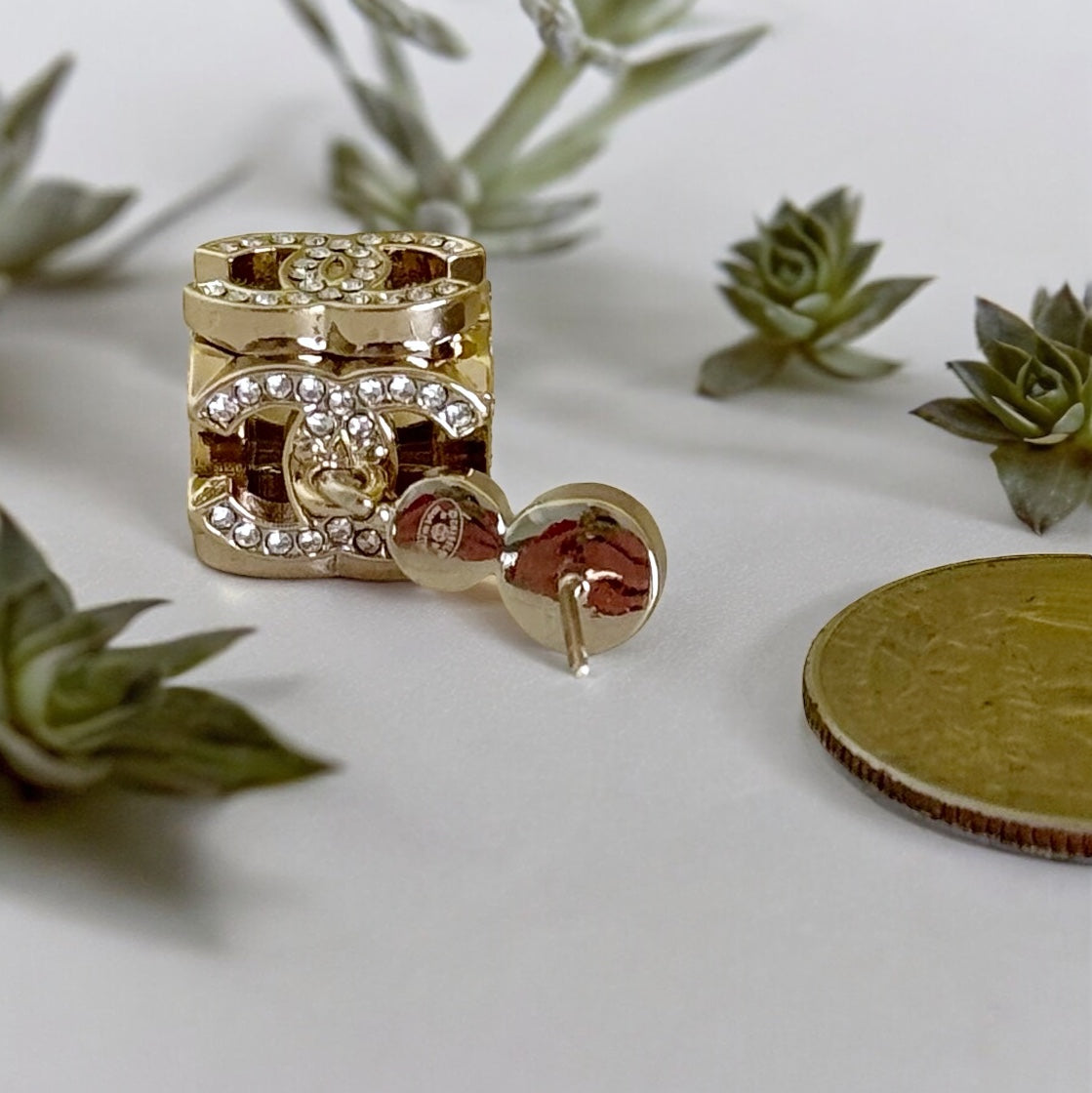 Chanel Gorgeous Rare Post Earrings with stunning Gold Double C encrusted clear crystalsThese Chanel earrings feature a stunning gold double C design, encrusted with clear crystals and a faux pearl center. The rare and like-new condition is reflected in th My Mama Found What