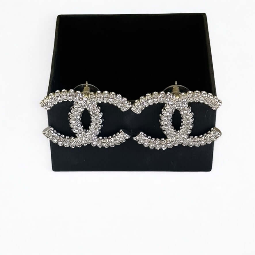 Chanel Silver CC Big Earrings encrusted with crystals, pre-owned, authentic, elegant statement jewelry.