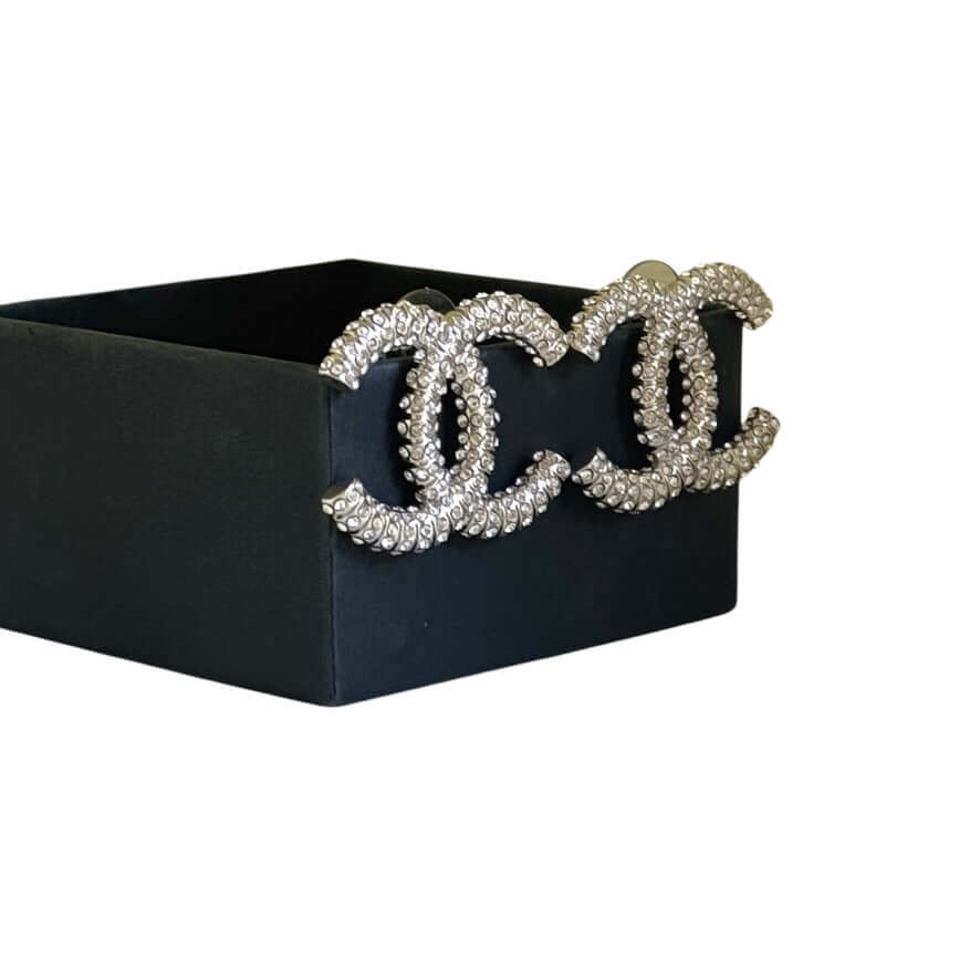 Elegant Chanel Silver CC Big Earrings encrusted with crystals in a black box, pre-owned and authentic, ready to elevate your style.
