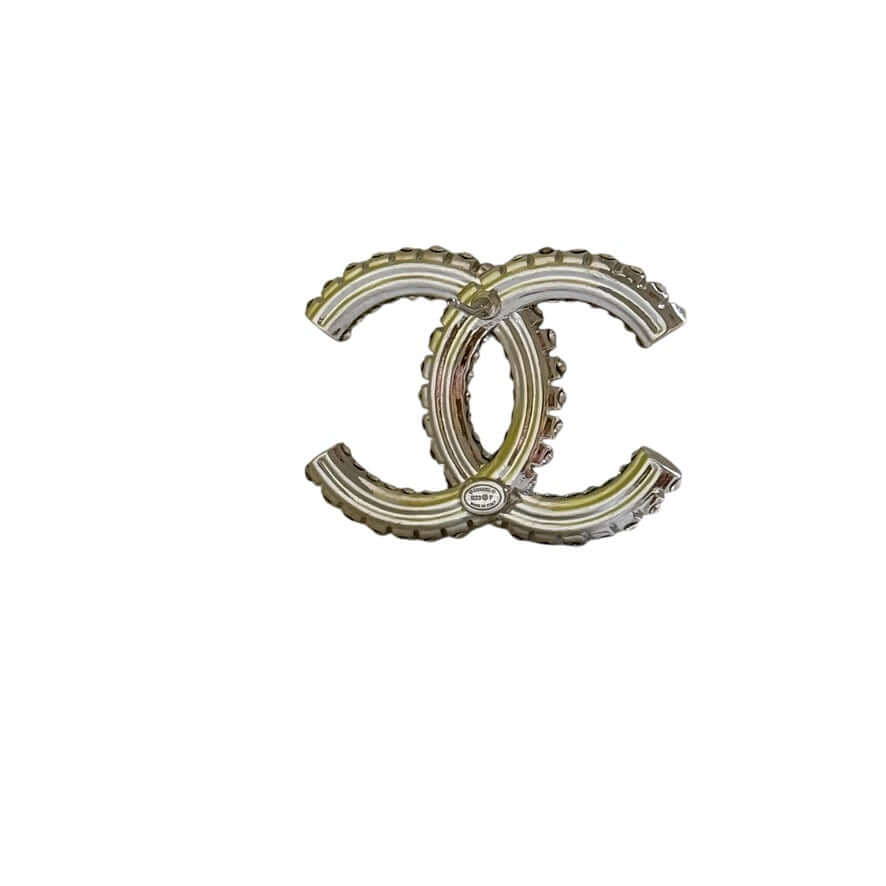Vintage Chanel Double CC Brooch in Silver, stylish accessory with intricate detailing, perfect for collectors and fashion enthusiasts.