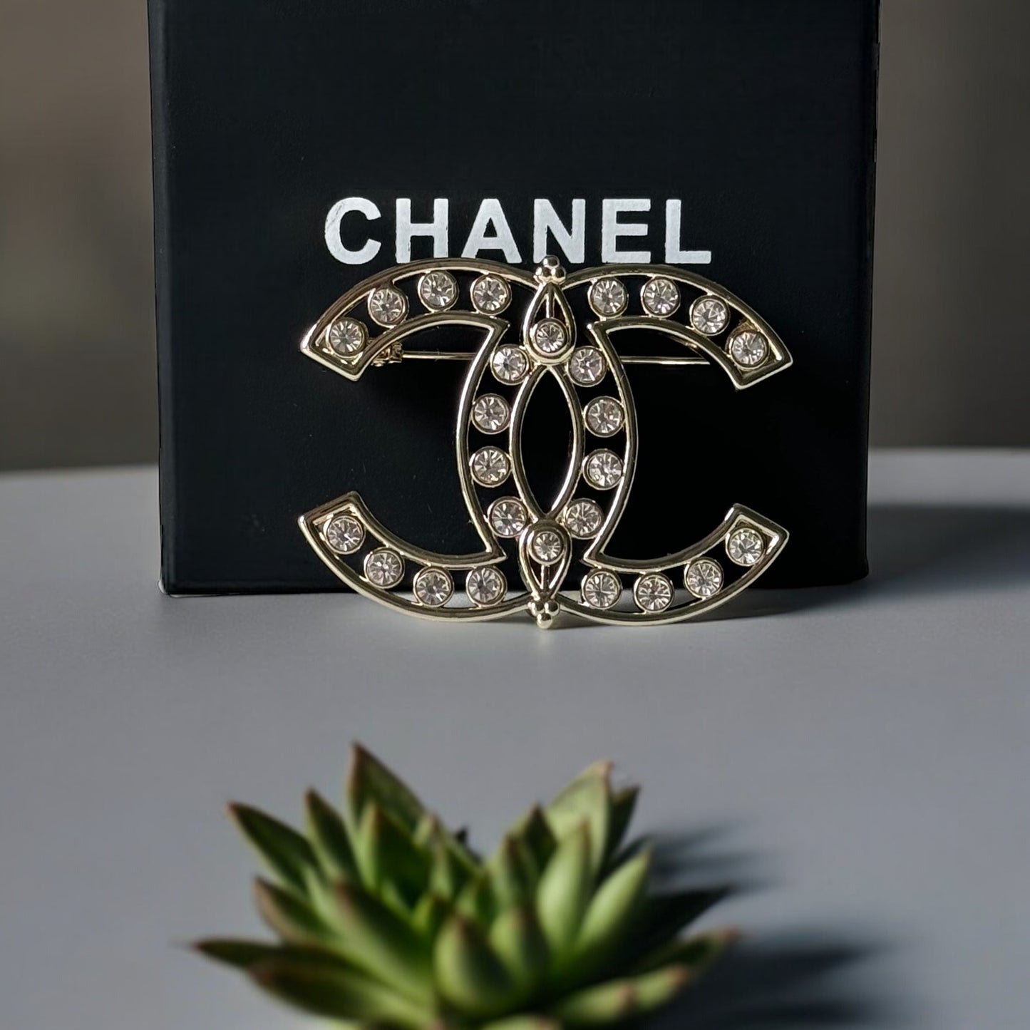 Chanel Strass Double C Cut Out with Clear Crystals Brooch Pin B23 ATransform any outfit into a statement piece with the Chanel Gold Double C brooch. Made in Italy, this brooch features bright clear crystals in Coco Chanel's signature cut-out design. Perfe My Mama Found What