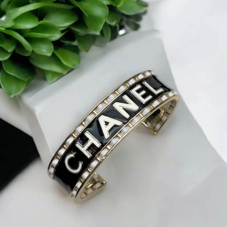 Authentic Chanel Mark Black White Enamel w/ white leather weaved throughout Cuff Pre-Owned - My Mama Found What