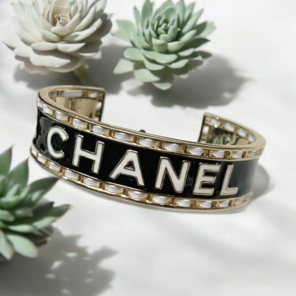 Authentic Chanel Mark Black White Enamel w/ white leather weaved throughout Cuff Pre-Owned - My Mama Found What