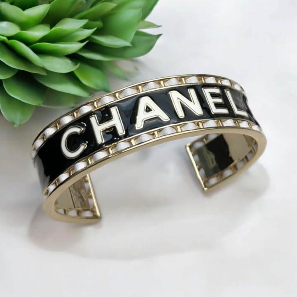 Authentic Chanel Mark Black White Enamel w/ white leather weaved throughout Cuff Pre-Owned - My Mama Found What