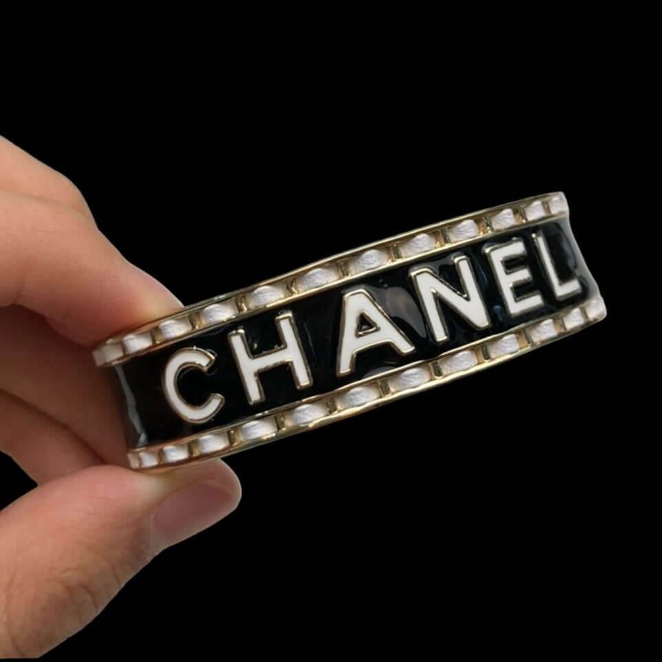 Authentic Chanel Mark Black White Enamel w/ white leather weaved throughout Cuff Pre-Owned - My Mama Found What