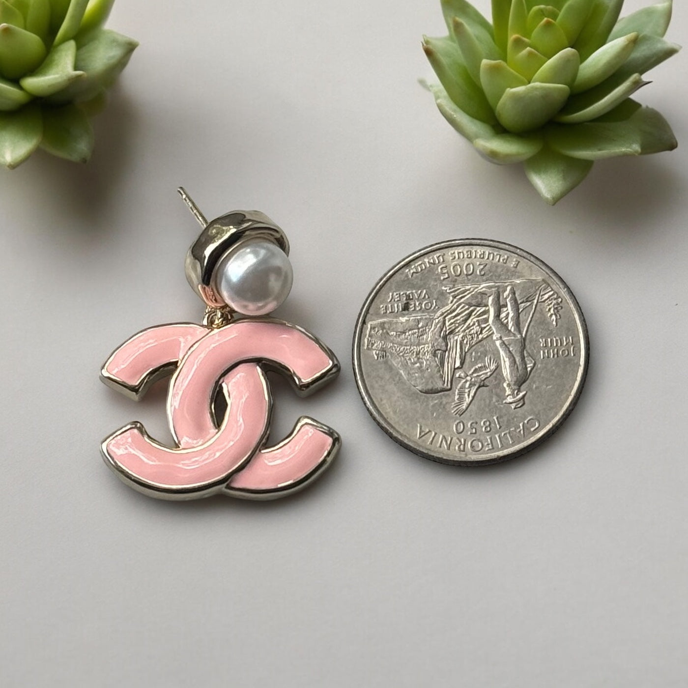 Chanel Lighter Gold Strass Pearl Post with Bigger Pink Enamel Double C Dangle EarringsAdd some playful CoCo Chanel style to your look with these gorgeous earrings! These earrings are a statement piece that will never go out of style. Made in Italy, they f