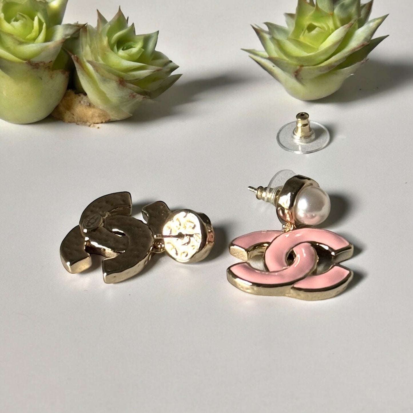 Chanel Lighter Gold Strass Pearl Post with Bigger Pink Enamel Double C Dangle EarringsAdd some playful CoCo Chanel style to your look with these gorgeous earrings! These earrings are a statement piece that will never go out of style. Made in Italy, they f