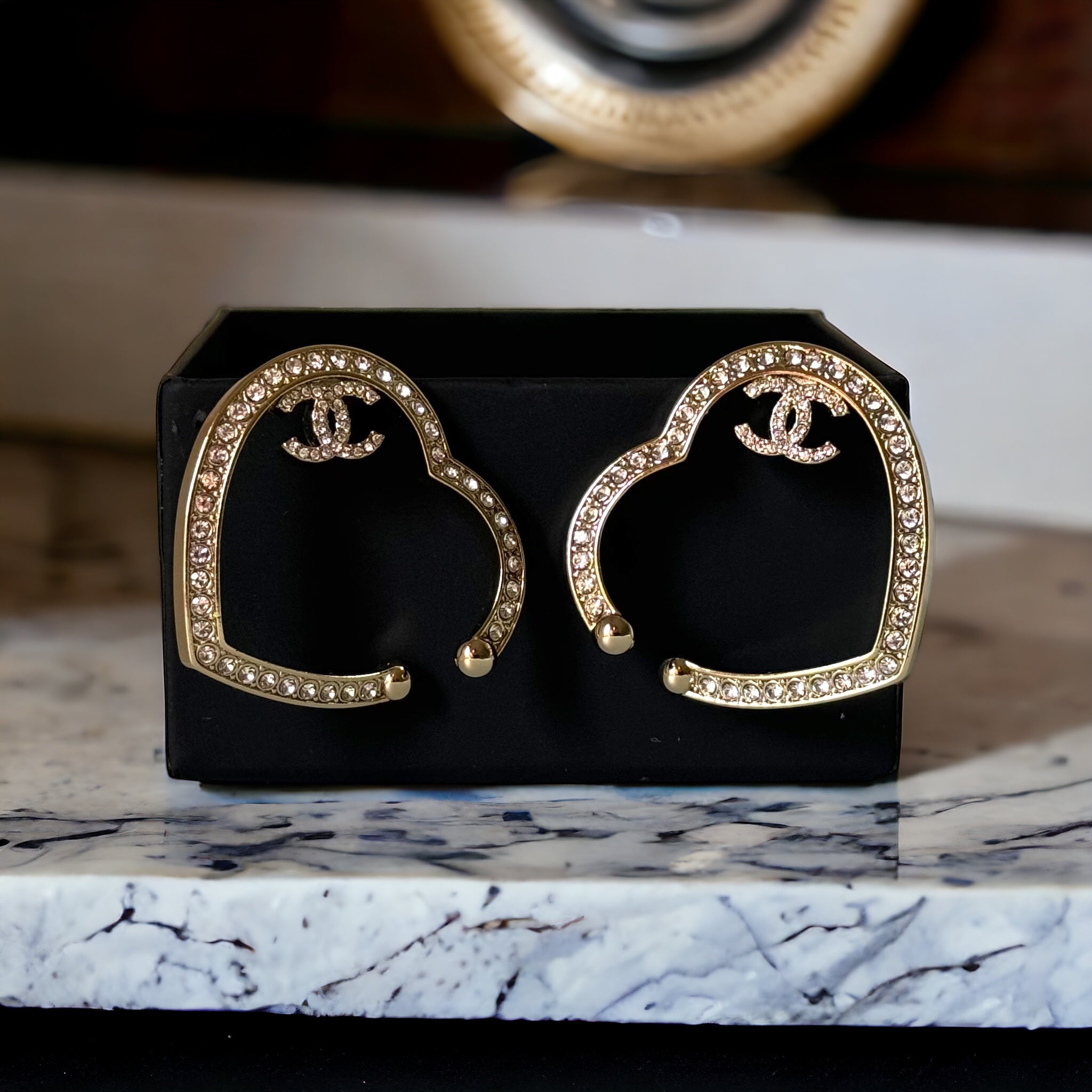 authentic,pre-owned CHANEL jewelry, CC, Like New, luxury designer , gift , on sale, CHANEL ,hard to find Pre-Owned , Luxury Designer, Authentic Chanel Gold Plated Big Cut Out Heart with Crystals Clip On EarringsGold Chanel Big Cut Out Heart Earrings with smaller clear crystals along the edges Purchased at an Estate Sale - The woman was an avid collector of high-end luxury designer jewelry , acces