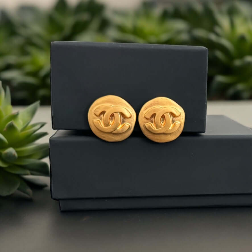 Chanel Bright Gold CC Clip On'sUnleash your bold, adventurous spirit with Chanel Bright Gold CC Clip On's! These classic and iconic earrings feature a bright smooth gold finish and CC logo, perfect for making a statement. With a like-new condition, you'll My Mama Found What