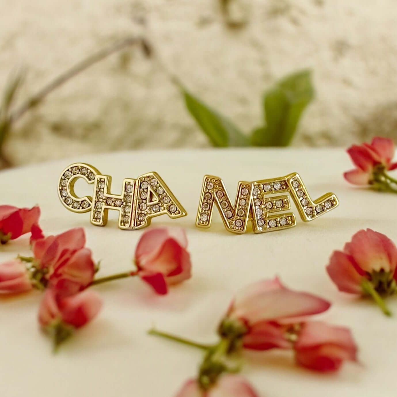Chanel 14K Gold Name Cut-Out w/ clear crystals earringsAdd a touch of elegance and playfulness to your outfit with these Chanel 14K Gold Cut-Out Name earrings. The clear crystals add a subtle sparkle, making them perfect for any occasion. Their smaller si My Mama Found What