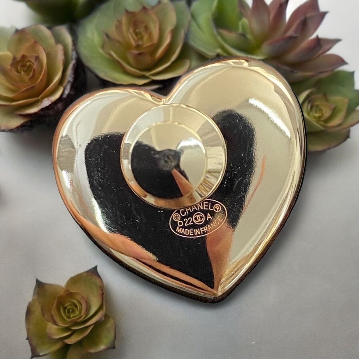 Chanel Gold Strass Heart Black Leather Double C Brooch PinChanel Gold , Strass and Black Soft Looking Heart Shaped Pin Perfect minimalistic size - Little bigger than a U.S. quarter coin . Clearly stamped on the back S22 22A Made in France On consignment L My Mama Found What