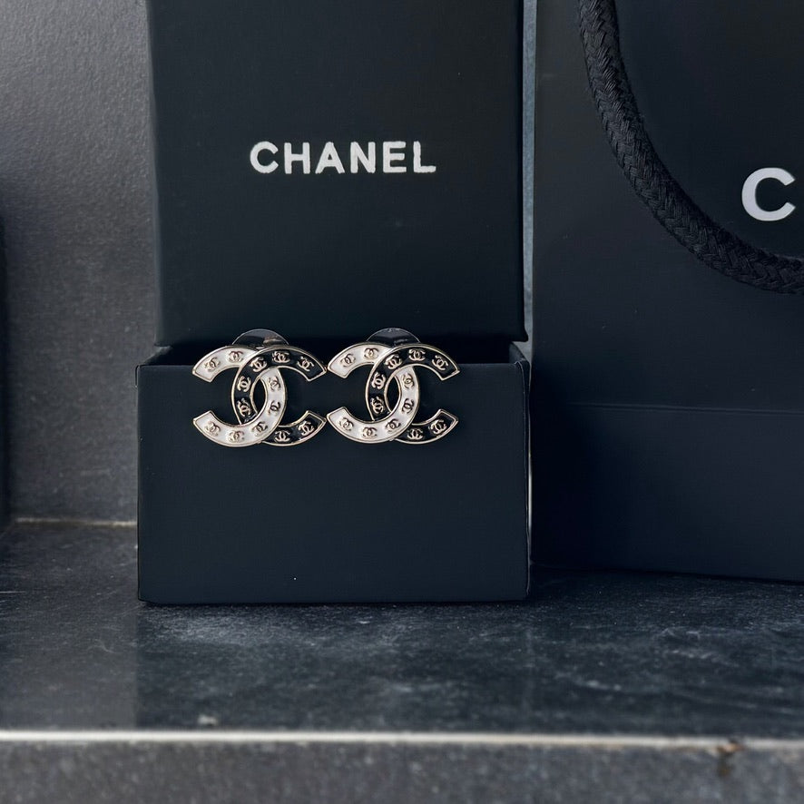 Chanel Gold Plated Double C with Black White Enamel with Mini Gold Double C’s Post EarringsLove these ! Love this season and style of Chanel ! Indulge in the epitome of luxury with these Chanel Gold Plated Double C earrings. The striking black and white e