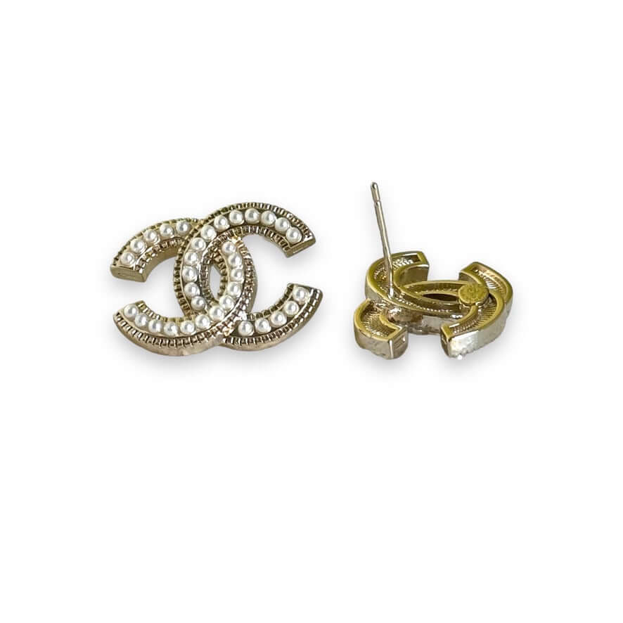 Chanel CC lighter gold tone post earrings encrusted with faux pearls, perfect for both casual and dressier everyday wear.