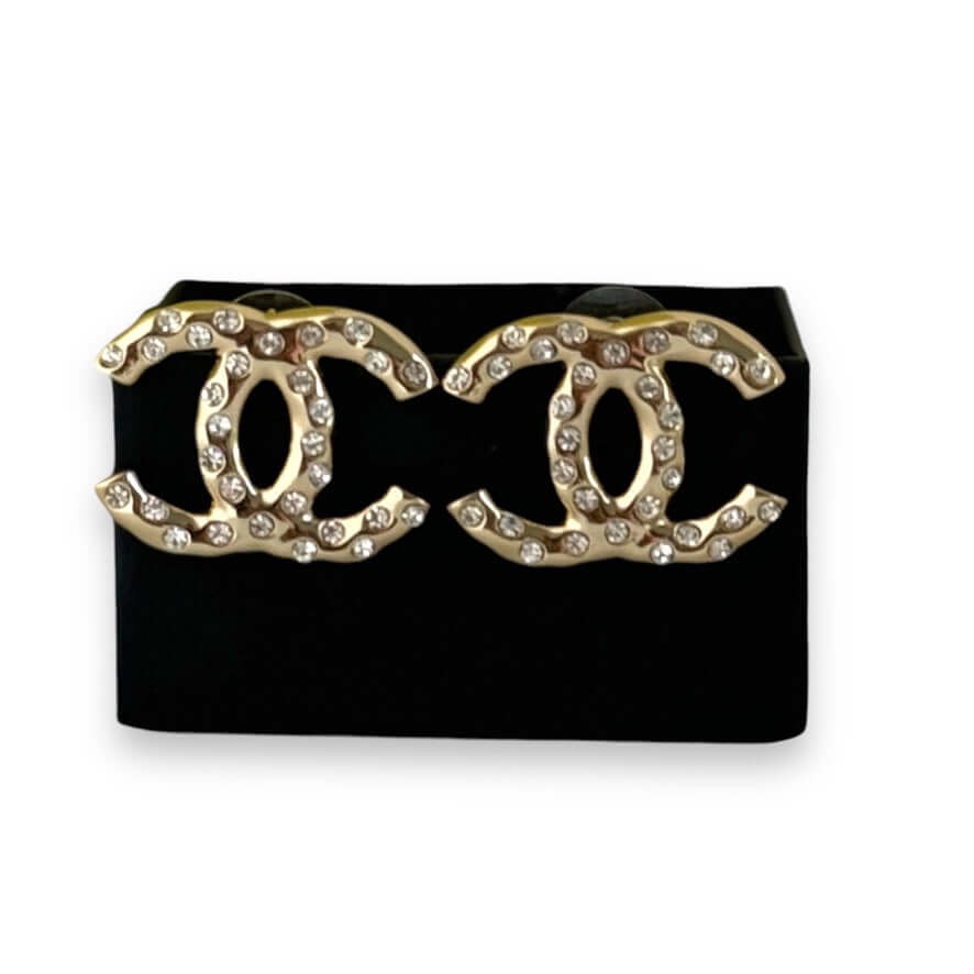 Authentic Chanel Gold CC earrings with sparkling crystals in excellent pre-owned condition, perfect for stylish occasions.