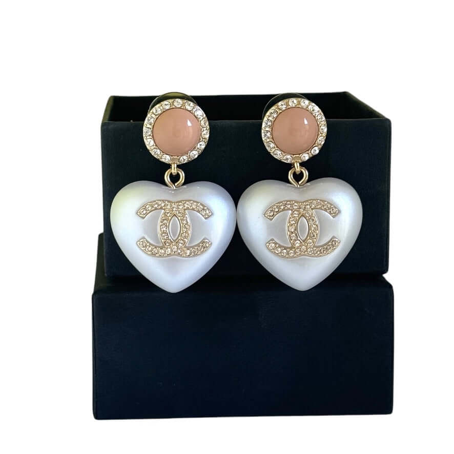 Rare Authentic Chanel CC Pink and White Heart Dangle Earrings Pre-Owned, featuring playful design and classic logo.