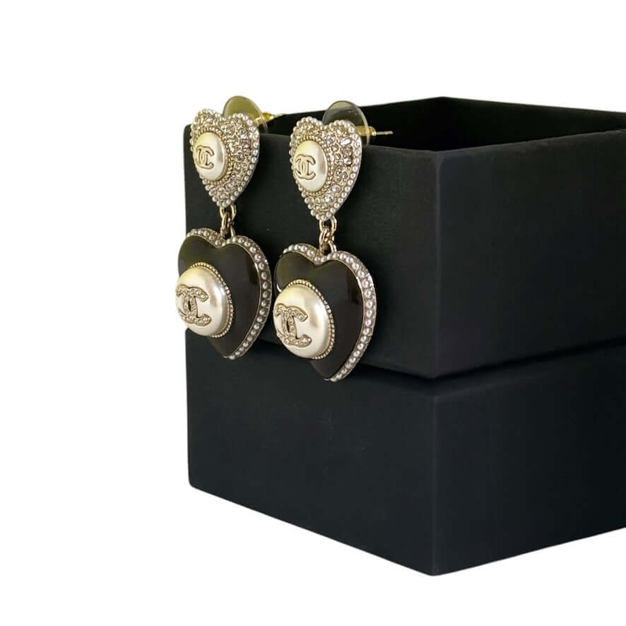 Stunning Authentic Chanel Gold Heart CC Dangle Earrings with sparkling crystals, displayed in a sleek gift box. Pre-Owned.