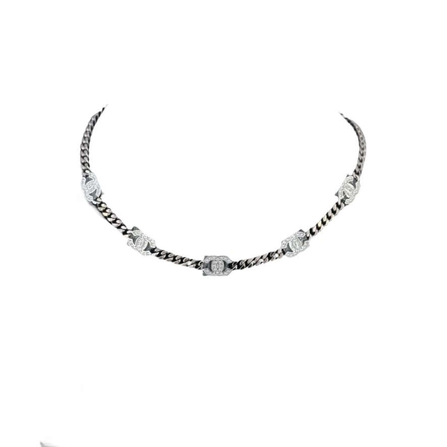 Authentic Chanel CC Chain Choker in gun metal, featuring crystal-encrusted CCs, adjustable and in excellent like-new condition.