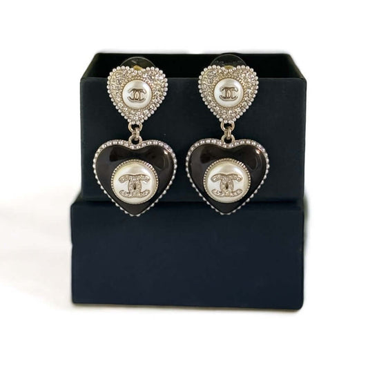 Stunning pre-owned Chanel Gold Heart CC Dangle Earrings with crystals and pearls in elegant gift box.