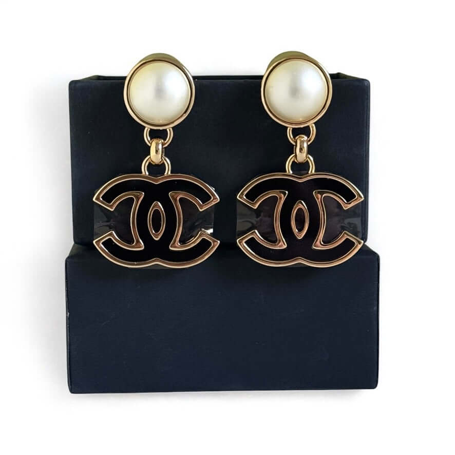 Authentic Chanel CC Gold White Black Dangle Earrings in like-new condition, complete with gift box. Perfect for any fashionista.