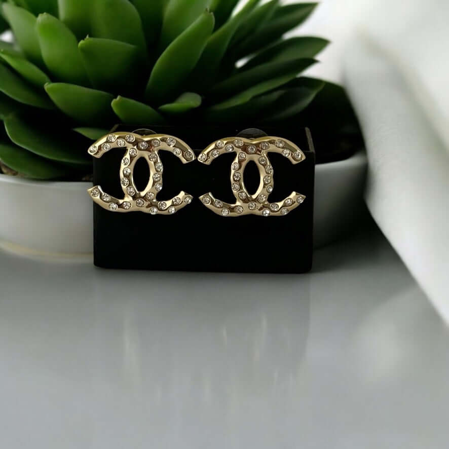 Authentic Chanel Gold CC earrings with crystals in like-new condition, perfect for a stylish statement.