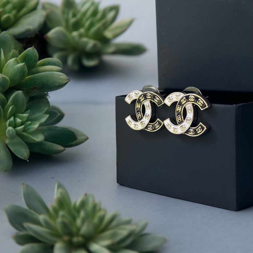 Chanel Gold Plated Double C with Black White Enamel with Mini Gold Double C’s Post EarringsLove these ! Love this season and style of Chanel ! Indulge in the epitome of luxury with these Chanel Gold Plated Double C earrings. The striking black and white e