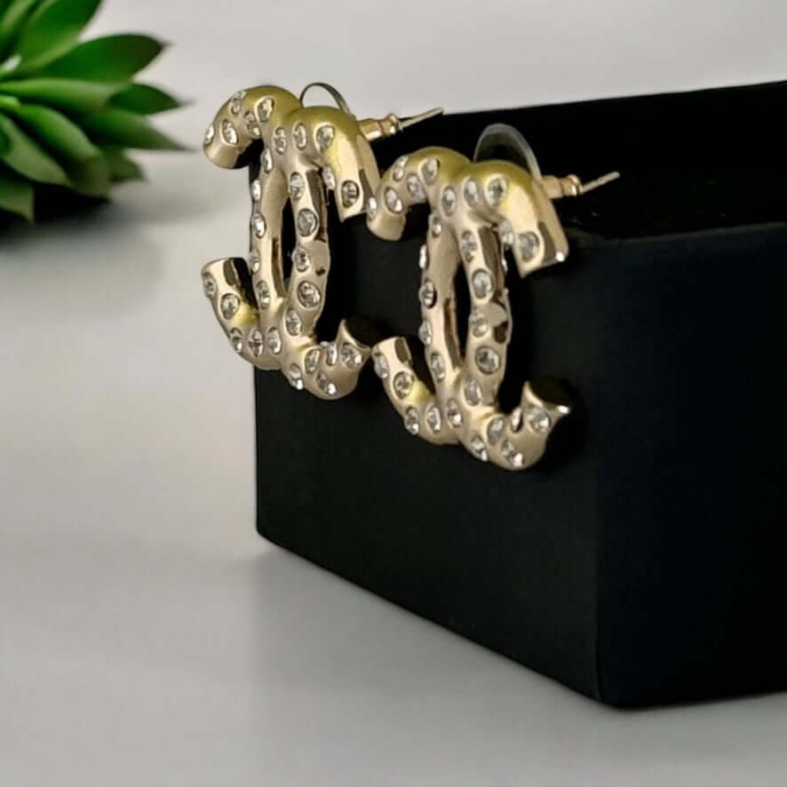 Authentic Chanel Gold CC earrings with crystals in excellent pre-owned condition, perfect statement piece in gift box.