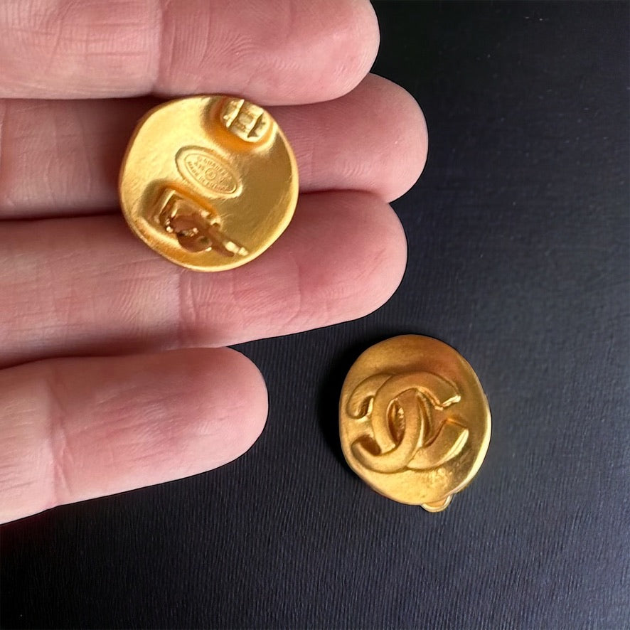 Chanel Vintage Bright Gold Double CVintage Chanel Clip On’s Bright Gold Double C Purchased at an Estate Sale These look like they were never ever worn Free from dings , scratches Gift Giving Condition 18K-24K Bright Gold These are amazing !! Very Rare in