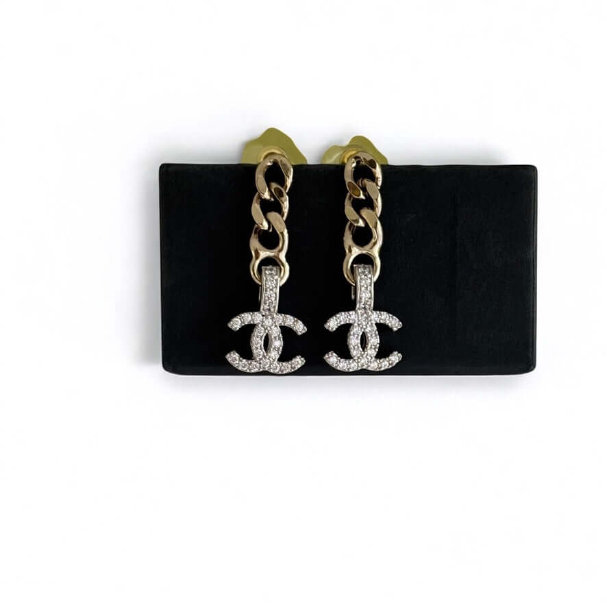 Chanel CC Gold Chain Drop Crystal Encrusted Earrings on display; pre-owned elegance perfect for any outfit.