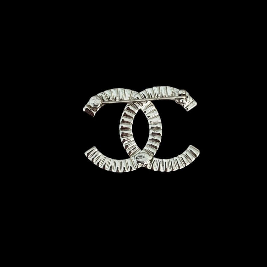 Authentic CHANEL Lighter Gold CC Brooch with sparkling crystals, pre-owned and like new condition, elegant fashion accessory.