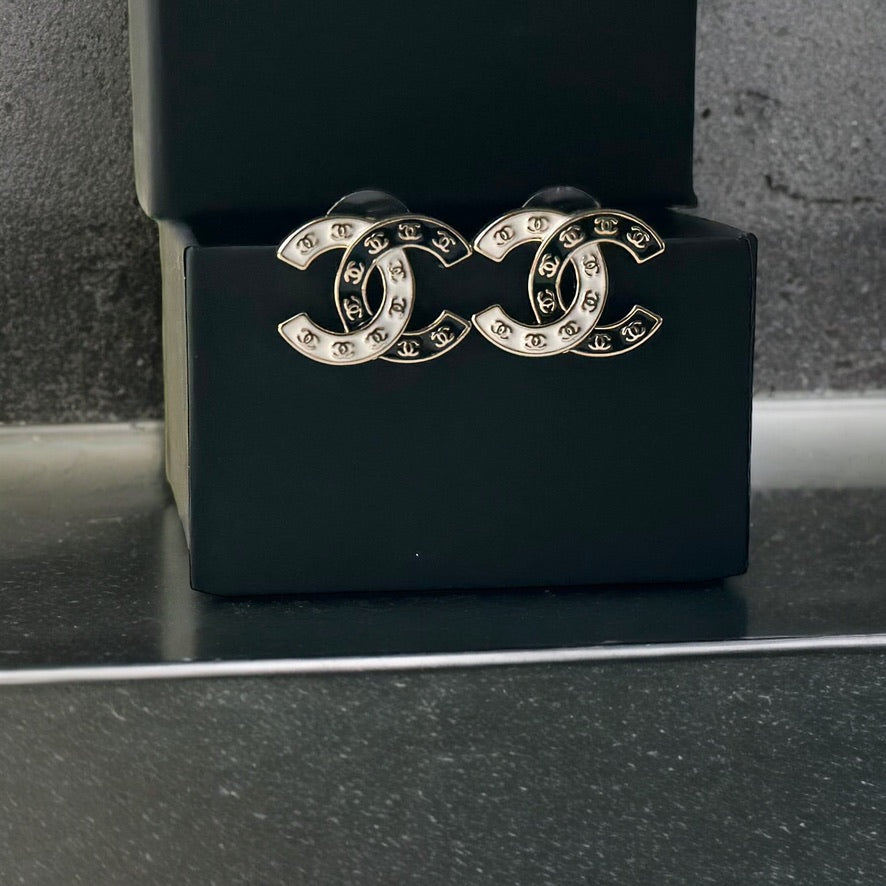 Chanel Gold Plated Double C with Black White Enamel with Mini Gold Double C’s Post EarringsLove these ! Love this season and style of Chanel ! Indulge in the epitome of luxury with these Chanel Gold Plated Double C earrings. The striking black and white e