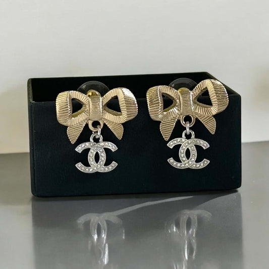 Image of CHANEL Gold Bow Earrings with silver CC earrings 