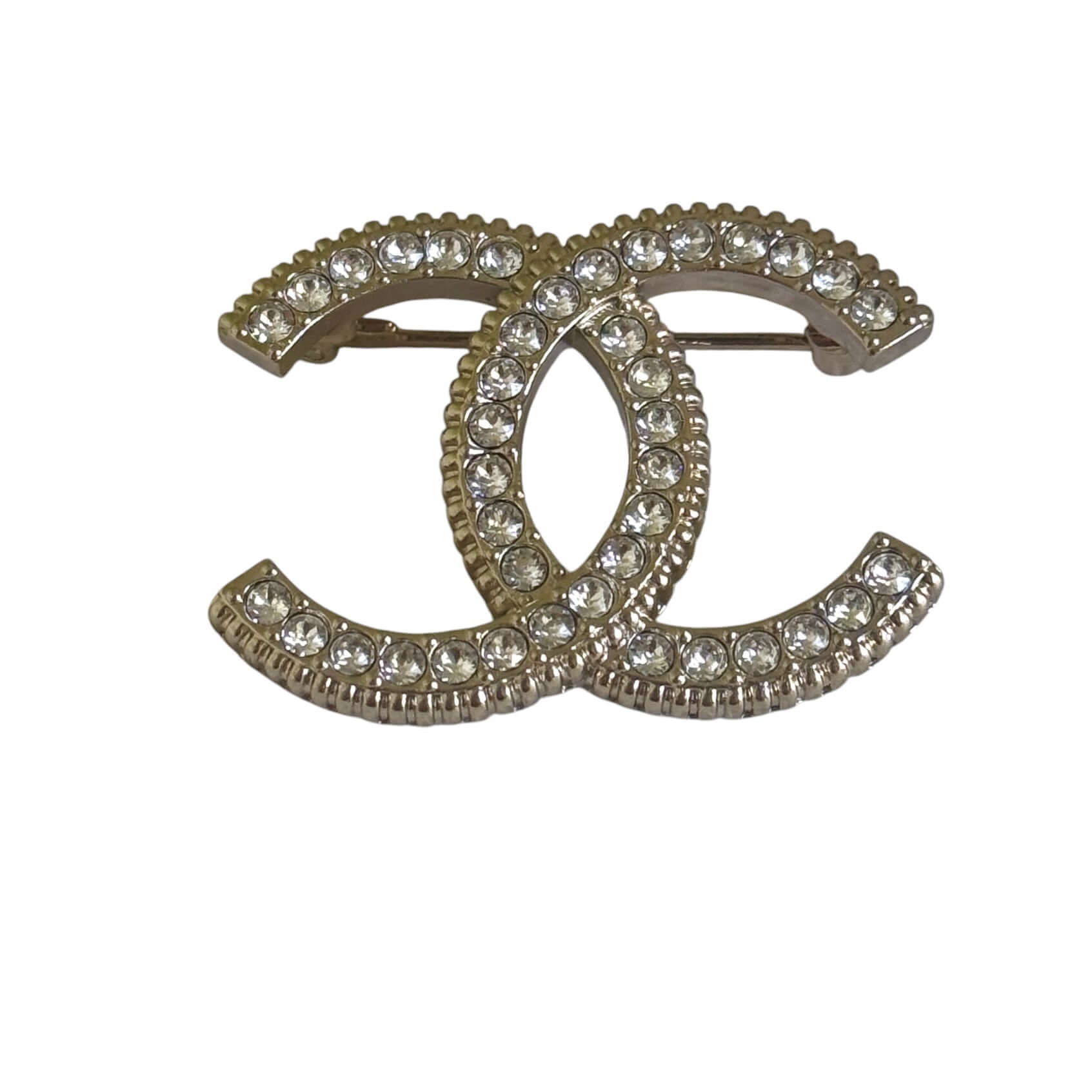 Stunning CHANEL Lighter Gold CC brooch with clear crystals, perfect for year-round wear day or night.