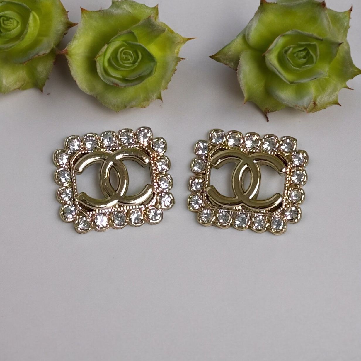 Chanel Gold Double C cut out with bright clear crystals post earringsAdd some timeless and classic bling to your wardrobe with these gorgeous Chanel Gold Double C earrings. Their bright clear crystals add just the right amount of sparkle to any outfit, ma