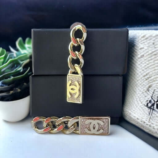 Chanel Gold Plated Chain Double C crystals Dangle EarringsAdd some rockstar flair to your wardrobe with these show-stopping Chanel Gold Plated Chain Double C crystals Dangle Earrings. The double C design and dangling movement make a statement that can't b