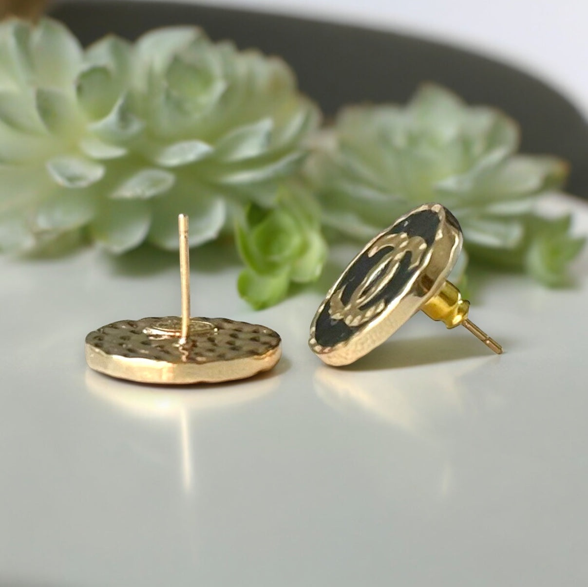 Chanel Gold Double C Textured Black Enamel Round Earrings 24 C Made in ItalyElevate any outfit with Chanel's iconic Gold Double C Textured Black Enamel Earrings. Made in Italy with a stunning minimal texture and smooth black enamel, these round post earri My Mama Found What 