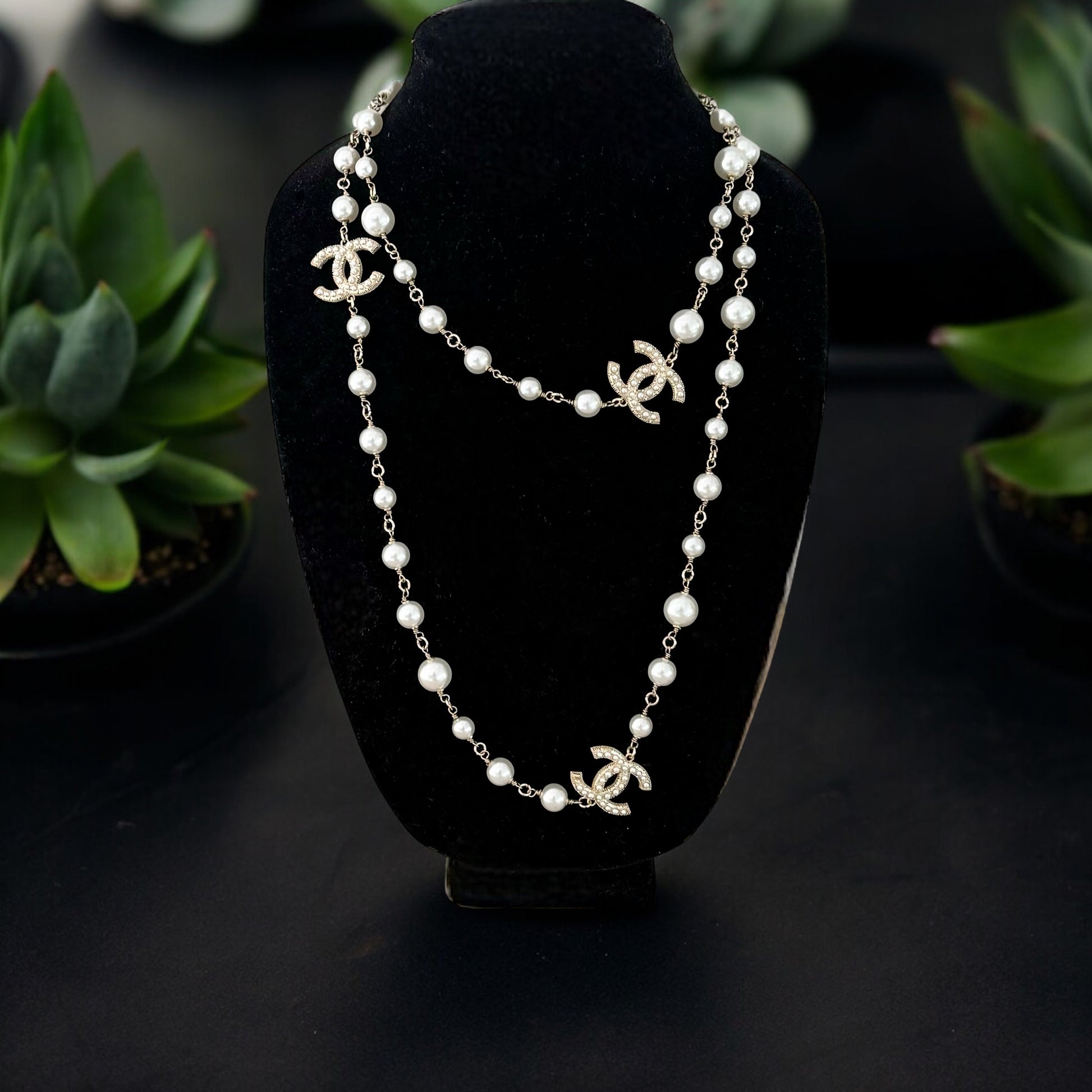Chanel Gold , Pearl Double C Double Wrap Adjustable NecklaceGet ready to shine with this updated and iconic Chanel necklace! The double wrap design and lighter gold wire give a modern twist to the classic double C charm and pearls. Perfect for any occasio