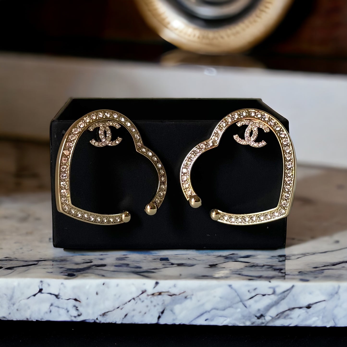 CHANEL CC authentic,pre-owned CHANEL jewelry, CC, Like New, luxury designer , gift , on sale, CHANEL ,hard to find Pre-Owned , Luxury Designer, Authentic Chanel Gold Plated Big Cut Out Heart with Crystals Clip On EarringsGold Chanel Big Cut Out Heart Earrings with smaller clear crystals along the edges Purchased at an Estate Sale - The woman was an avid collector of high-end luxury designer jewelry , acces My Mama Found What 