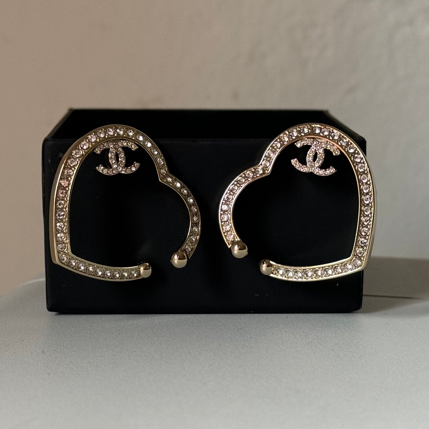 CHANEL CC authentic,pre-owned CHANEL jewelry, CC, Like New, luxury designer , gift , on sale, CHANEL ,hard to find Pre-Owned , Luxury Designer, Authentic Chanel Gold Plated Big Cut Out Heart with Crystals Clip On EarringsGold Chanel Big Cut Out Heart Earrings with smaller clear crystals along the edges Purchased at an Estate Sale - The woman was an avid collector of high-end luxury designer jewelry , acces My Mama Found What 
