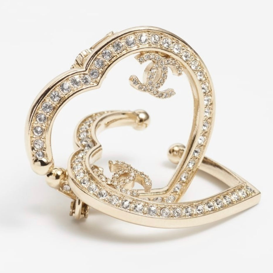 CHANEL CC authentic,pre-owned CHANEL jewelry, CC, Like New, luxury designer , gift , on sale, CHANEL ,hard to find Pre-Owned , Luxury Designer, Authentic Chanel Gold Plated Big Cut Out Heart with Crystals Clip On EarringsGold Chanel Big Cut Out Heart Earrings with smaller clear crystals along the edges Purchased at an Estate Sale - The woman was an avid collector of high-end luxury designer jewelry , acces
