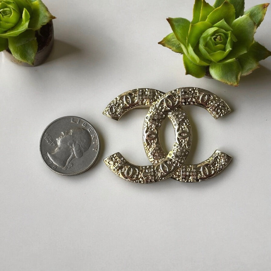 Chanel Gold Plated Textured Double C Brooch PinGorgeous , Ageless , Timeless , Extra Comes with the Chanel Box & Bag Add some whimsy to your outfit with this Chanel Gold Textured Double C Brooch Pin. This playful accessory features a unique textured desig My Mama Found What 