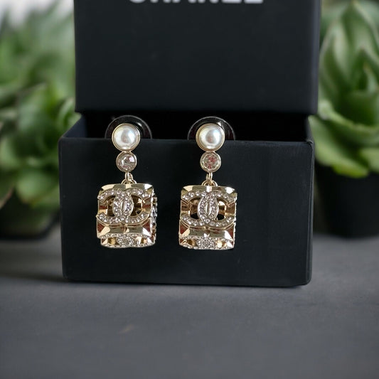 Chanel Gorgeous Rare Post Earrings with stunning Gold Double C encrusted clear crystalsThese Chanel earrings feature a stunning gold double C design, encrusted with clear crystals and a faux pearl center. The rare and like-new condition is reflected in th My Mama Found What 