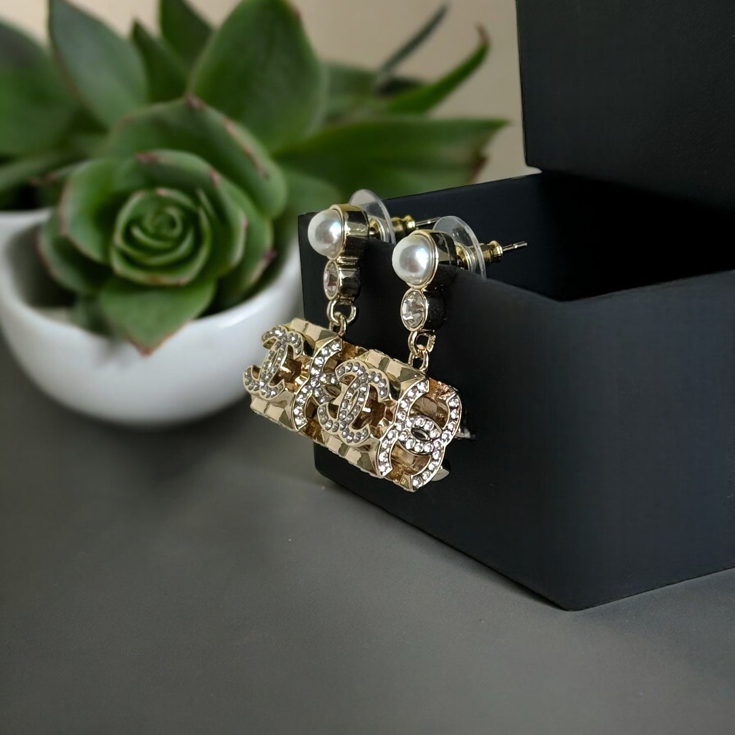 Chanel Gorgeous Rare Post Earrings with stunning Gold Double C encrusted clear crystalsThese Chanel earrings feature a stunning gold double C design, encrusted with clear crystals and a faux pearl center. The rare and like-new condition is reflected in th My Mama Found What 