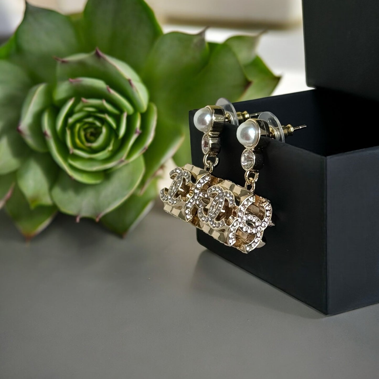 Chanel Gorgeous Rare Post Earrings with stunning Gold Double C encrusted clear crystalsThese Chanel earrings feature a stunning gold double C design, encrusted with clear crystals and a faux pearl center. The rare and like-new condition is reflected in th My Mama Found What 