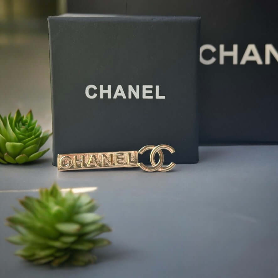 Chanel Lighter Gold Double C Engraved CHANEL Brooch PinThis Chanel brooch pin is a timeless accessory, featuring a lighter gold finish and double C design. With the CHANEL engraving, it exudes elegance and sophistication. Its smaller size makes it versati