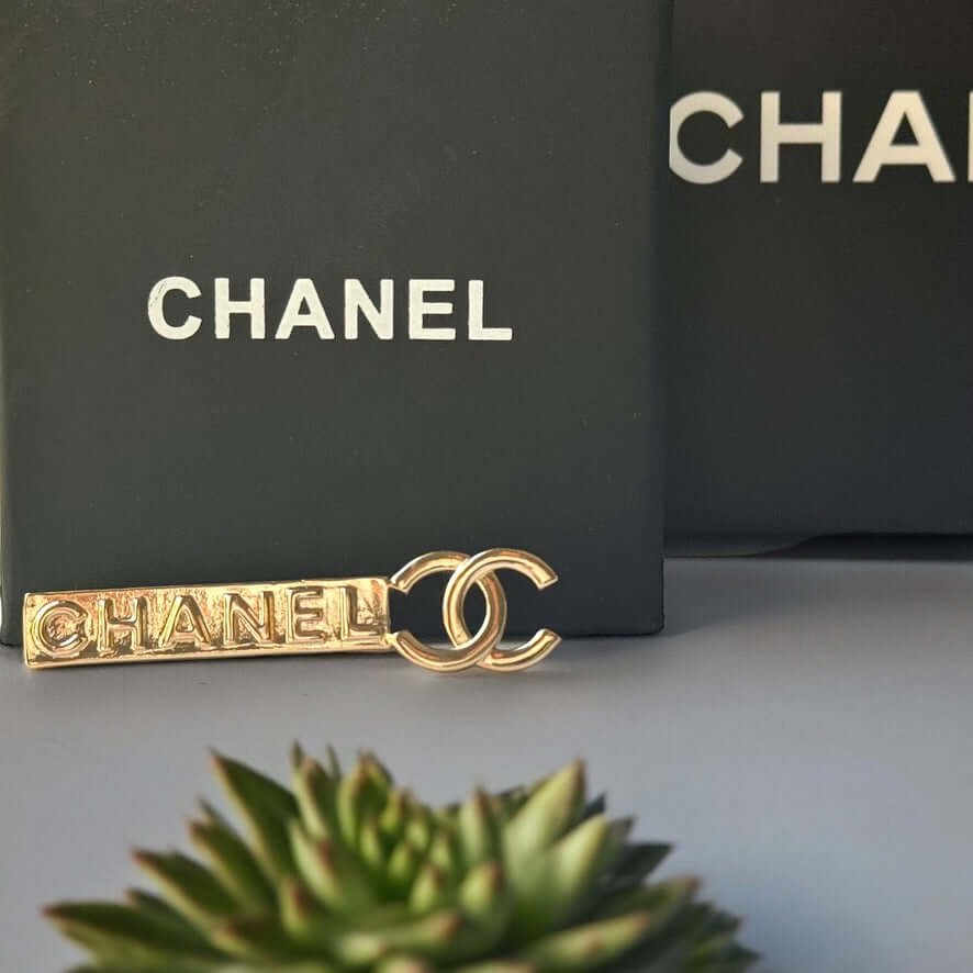 Chanel Lighter Gold Double C Engraved CHANEL Brooch PinThis Chanel brooch pin is a timeless accessory, featuring a lighter gold finish and double C design. With the CHANEL engraving, it exudes elegance and sophistication. Its smaller size makes it versati My Mama Found What 