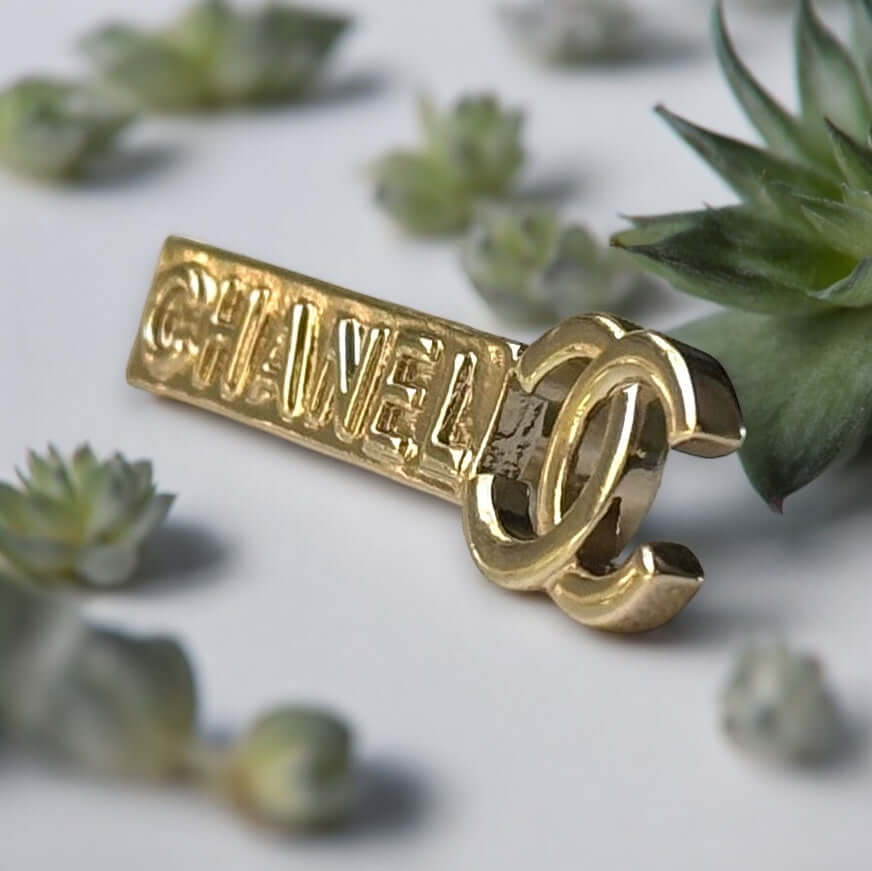 Chanel Lighter Gold Double C Engraved CHANEL Brooch PinThis Chanel brooch pin is a timeless accessory, featuring a lighter gold finish and double C design. With the CHANEL engraving, it exudes elegance and sophistication. Its smaller size makes it versati