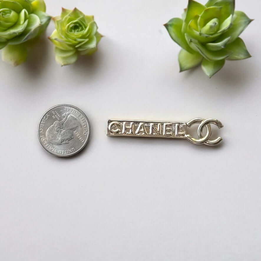 Chanel Lighter Gold Double C Engraved CHANEL Brooch PinThis Chanel brooch pin is a timeless accessory, featuring a lighter gold finish and double C design. With the CHANEL engraving, it exudes elegance and sophistication. Its smaller size makes it versati My Mama Found What 